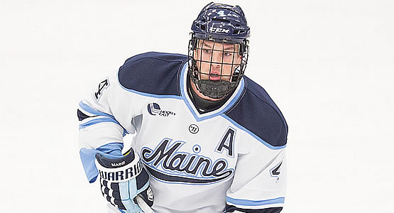 Boston College forward Alex Tuch (12) finds the puck to score